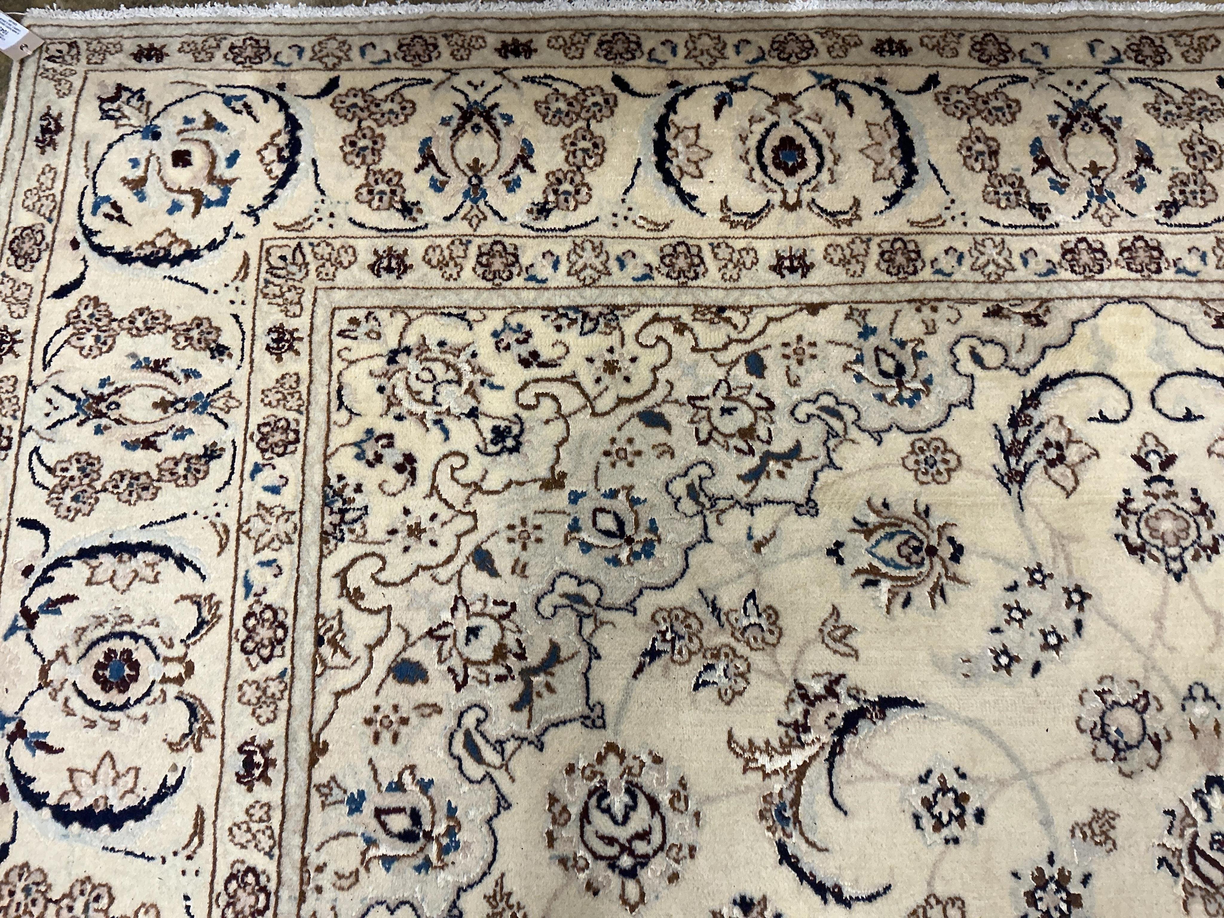 An ivory ground Nain carpet, 300cm x 206cm